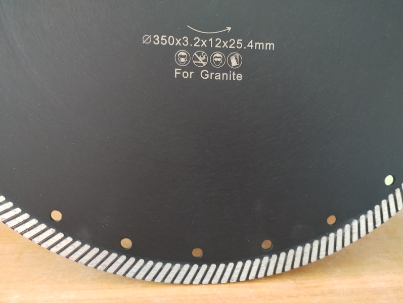 Diamond blade for cutting granite with turbo segment, diameter 350 mm, center hole 25.4 mm. Close-up view of marking and turbo segment