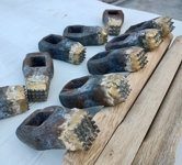 Bushhammers with 9, 12, 16, 20 and 25 teeth. Wooden handles. Side view