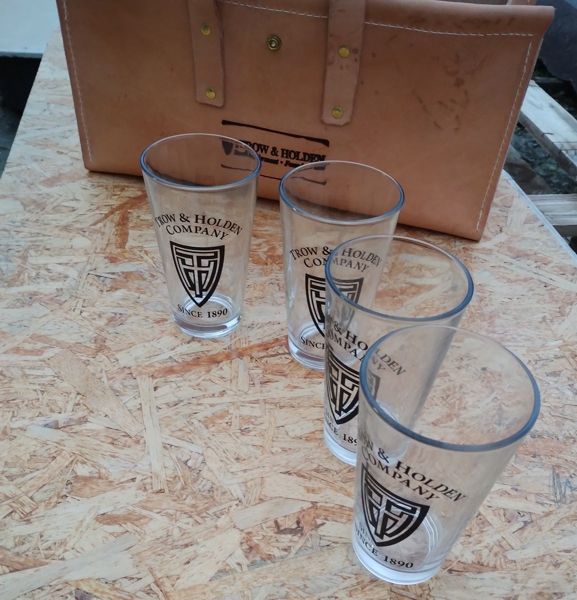 Trow & Holden glass drinking glasses on a leather bag background - real photo