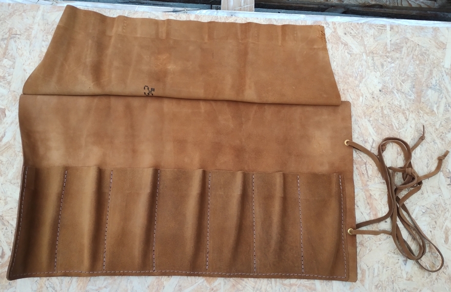 Leather case for stonemasonry tools with the lid unfolded - real photo