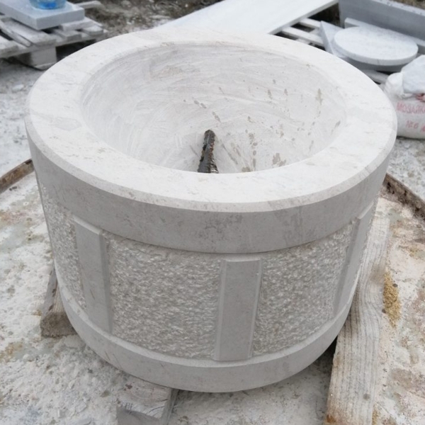 Making a drum from Vratchan stone, carved to be used as a pot or planter