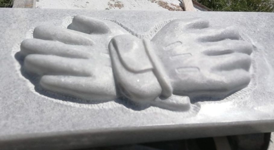 Making goalkeeper football gloves from marble, close up view